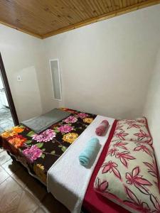 Uma cama ou camas num quarto em Casa em Ouro Preto