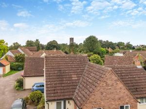a row of roofs in a residential neighborhood at Coconut Mill in Lavenham