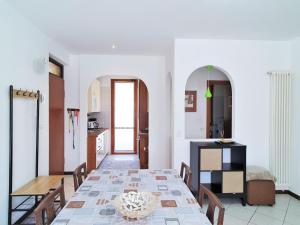 a kitchen and dining room with a table and chairs at Belvilla by OYO BOS03 3 in Grantola +32 photos