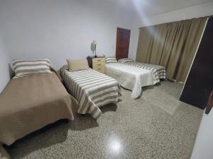 Een bed of bedden in een kamer bij MAILY Guest House