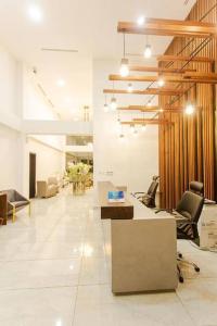 a lobby with chairs and desks in a building at One Luxury Bedroom Apartment @ The Signature in Accra