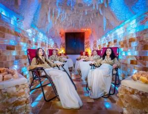 a group of women sitting in chairs in a room at Spa Hotel MILLENIUM Karlovy Vary in Karlovy Vary
