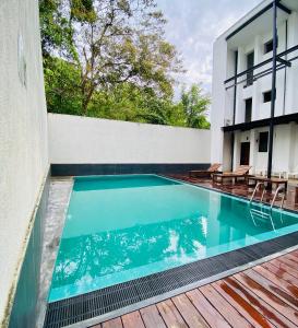 a swimming pool in the middle of a building at Hotel Kandyan View ''Free pickup from Kandy city'' in Kandy