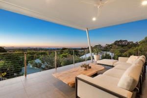 a living room with a couch and a table at Sanctuary Spaces - Sundowner in Byron Bay +40 photos