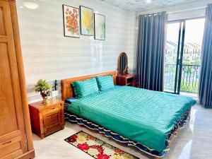 מיטה או מיטות בחדר ב-Thu Homestay Hội An