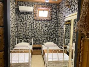 Postel nebo postele na pokoji v ubytování MANGAL HOTEL&HOSTEL