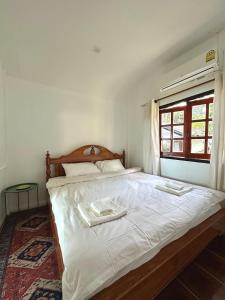 Ένα ή περισσότερα κρεβάτια σε δωμάτιο στο Beachfront house in Chaloklum +24 φωτογραφίες