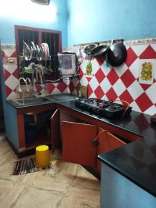 a kitchen with a sink and a counter top at Joe Niwas villa 3bhk in Puducherry