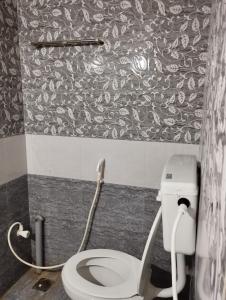 a bathroom with a white toilet in a room at Joe Niwas villa 3bhk in Puducherry