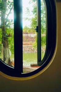 Ein Garten an der Unterkunft Boom Casa Homestay