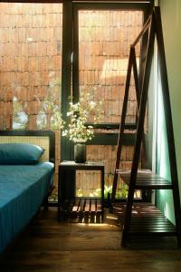 Ein Bett oder Betten in einem Zimmer der Unterkunft Boom Casa Homestay