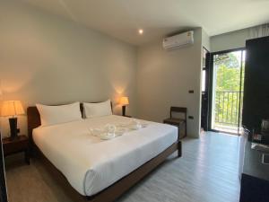 O2 The Residence โอทู เดอะ เรสซิเดนซ์客房内的一张或多张床位
