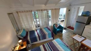 an aerial view of a living room with a balcony at Are Tamareni River Studio in Avarua