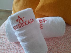Postel nebo postele na pokoji v ubytování ARISTOCASA