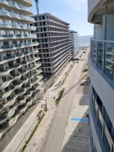 a view of the beach from a building at Studio Casa del Mar - Mathi in Mamaia +1 photo