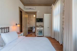 Postel nebo postele na pokoji v ubytování Elia Hotel Cunda by Ortunc