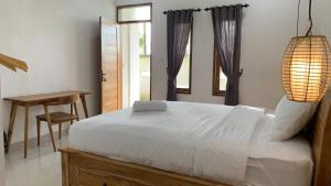 Postel nebo postele na pokoji v ubytování Kenan Cottage