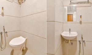 a bathroom with a toilet and a sink at FabHotel Siddharth Corporate in Gandhinagar