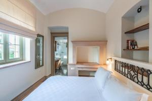 Postel nebo postele na pokoji v ubytování Elia Hotel Cunda by Ortunc