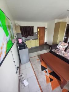 a living room with a couch and a table at Furnished studio apartment- Ngara in Nairobi