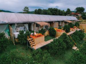 an overhead view of a large house with a deck at Paopao Orange Farm and Home stay in Mae Rim