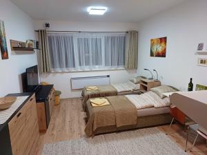 Postel nebo postele na pokoji v ubytování Apartmán Sedmička Horec