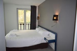 Postel nebo postele na pokoji v ubytování HOTEL VICTORIA