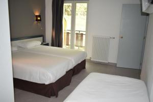 Postel nebo postele na pokoji v ubytování HOTEL VICTORIA