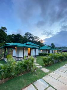 a row of bungalows in a resort at Redberry's Luxury Stay in Somvārpet