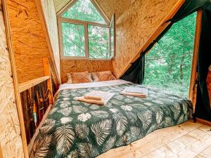 a bedroom in a tree house with a bed in it at Garemo in Ambrolauri +82 photos