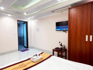 En eller flere senger på et rom på Quoc Tuan Hotel Sapa