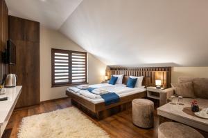 A bed or beds in a room at Beluga Guest House