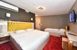 Postel nebo postele na pokoji v ubytování Sea Moon Hotel