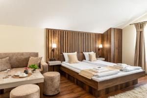 A bed or beds in a room at Beluga Guest House