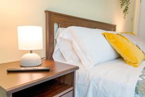 A bed or beds in a room at Appartamenti Vista Mole, Centro a 15 min - Luxury Suites & fast WiFi