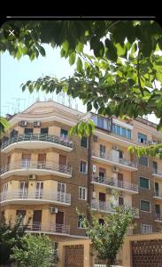 a tall building with balconies on the side of it at PeoniaMaximaHouse -Piazza Bologna- in Rome