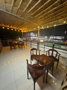 a group of tables and chairs on a baseball field at HomeStay 888 in Can Tho