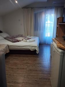 Postel nebo postele na pokoji v ubytování Lela