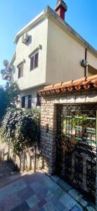 a building with a gate in front of it at Natalia Rooms Old Town in Herceg-Novi