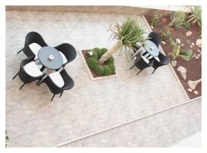 an overhead view of two chairs and a plant at Hotel El Trebol in Carboneras