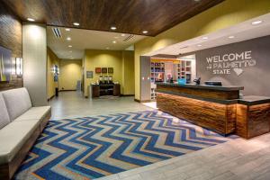 a lobby with a welcome desk and a waiting room at Hampton Inn & Suites Columbia/Southeast-Fort Jackson in Columbia