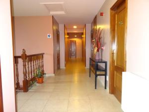 a hallway with a long hall with a stairwell at Hotel Akelarre in Santiago de Compostela