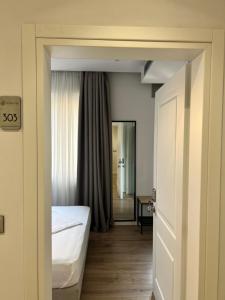 Postel nebo postele na pokoji v ubytování Enzo rooms & apartment Blloku