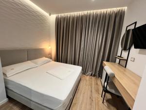 Postel nebo postele na pokoji v ubytování Enzo rooms & apartment Blloku