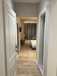 Postel nebo postele na pokoji v ubytování Enzo rooms & apartment Blloku