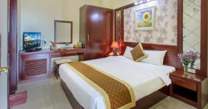 Ένα ή περισσότερα κρεβάτια σε δωμάτιο στο Sunview Beach Hotel Danang