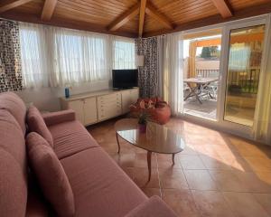 a living room with a couch and a table at Iberflat Fabiola in Seville