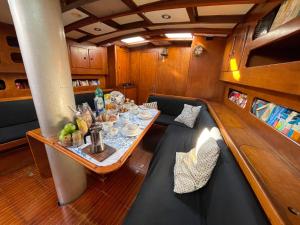 a table in the middle of a boat at SailBoat B&B on Board in Catania