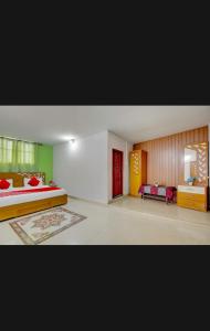 a bedroom with a bed and a couch in it at HILL BIRD HERITAGE HOME Stay in Ooty