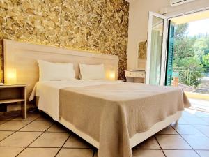 Posteľ alebo postele v izbe v ubytovaní Panorama Apartments Fiscardo